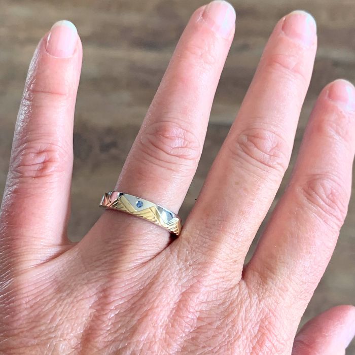 Model wearing mixed metal mountain ring band