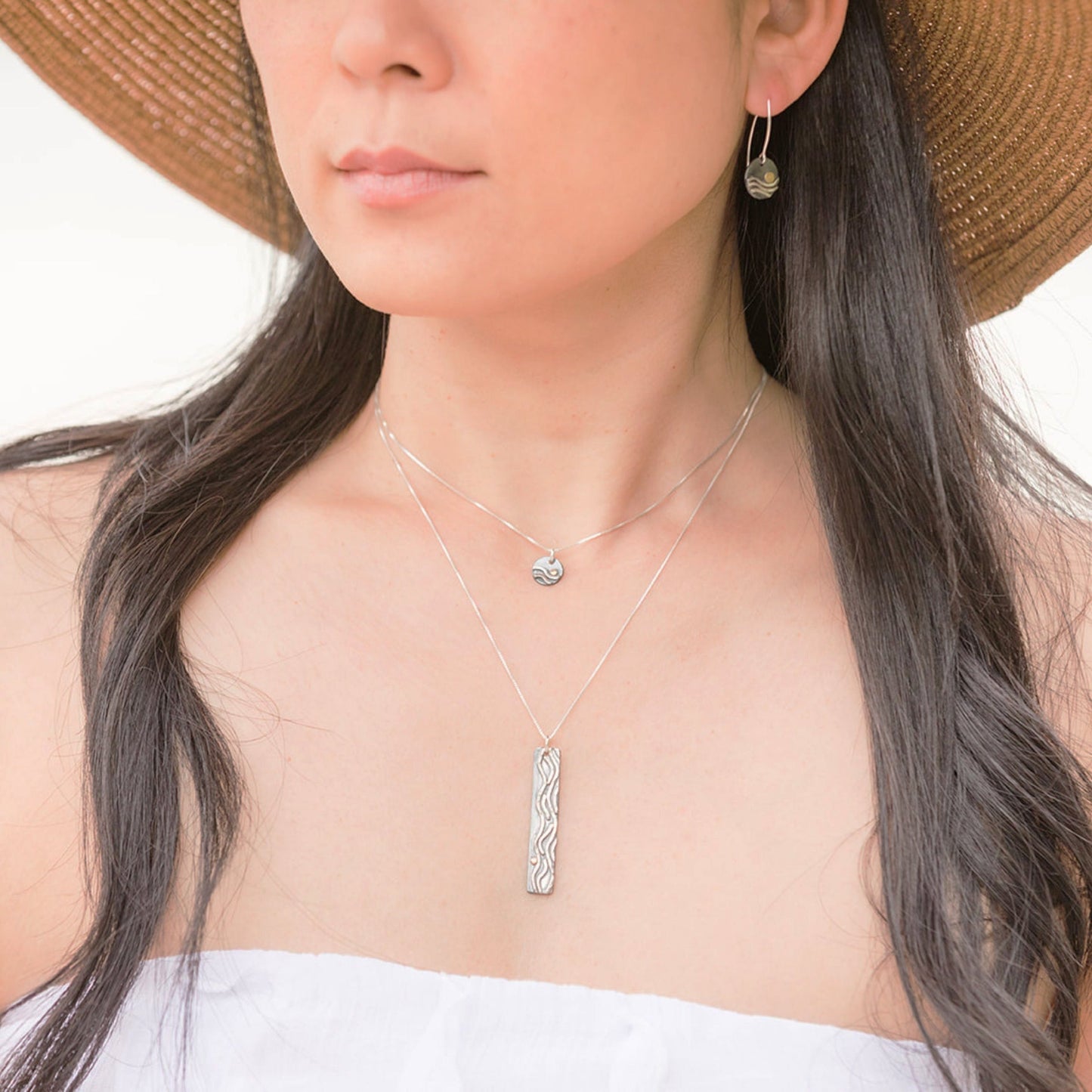 Reflections charm necklace on model