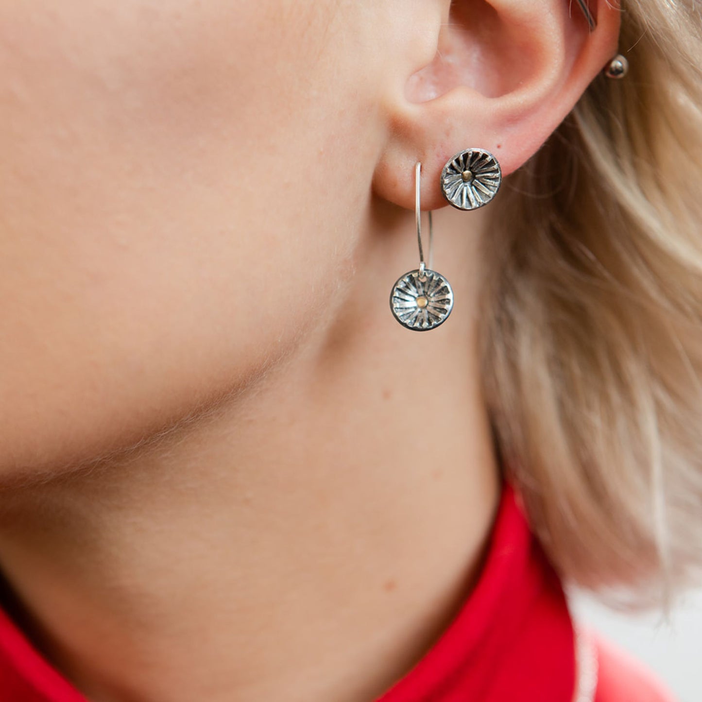 Closeup of model wearing radiance stud earrings