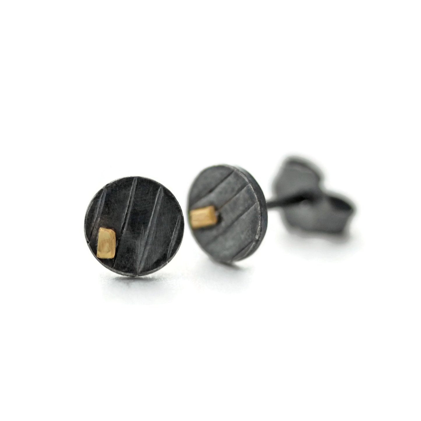 Small disc stud earrings with gold oxidized