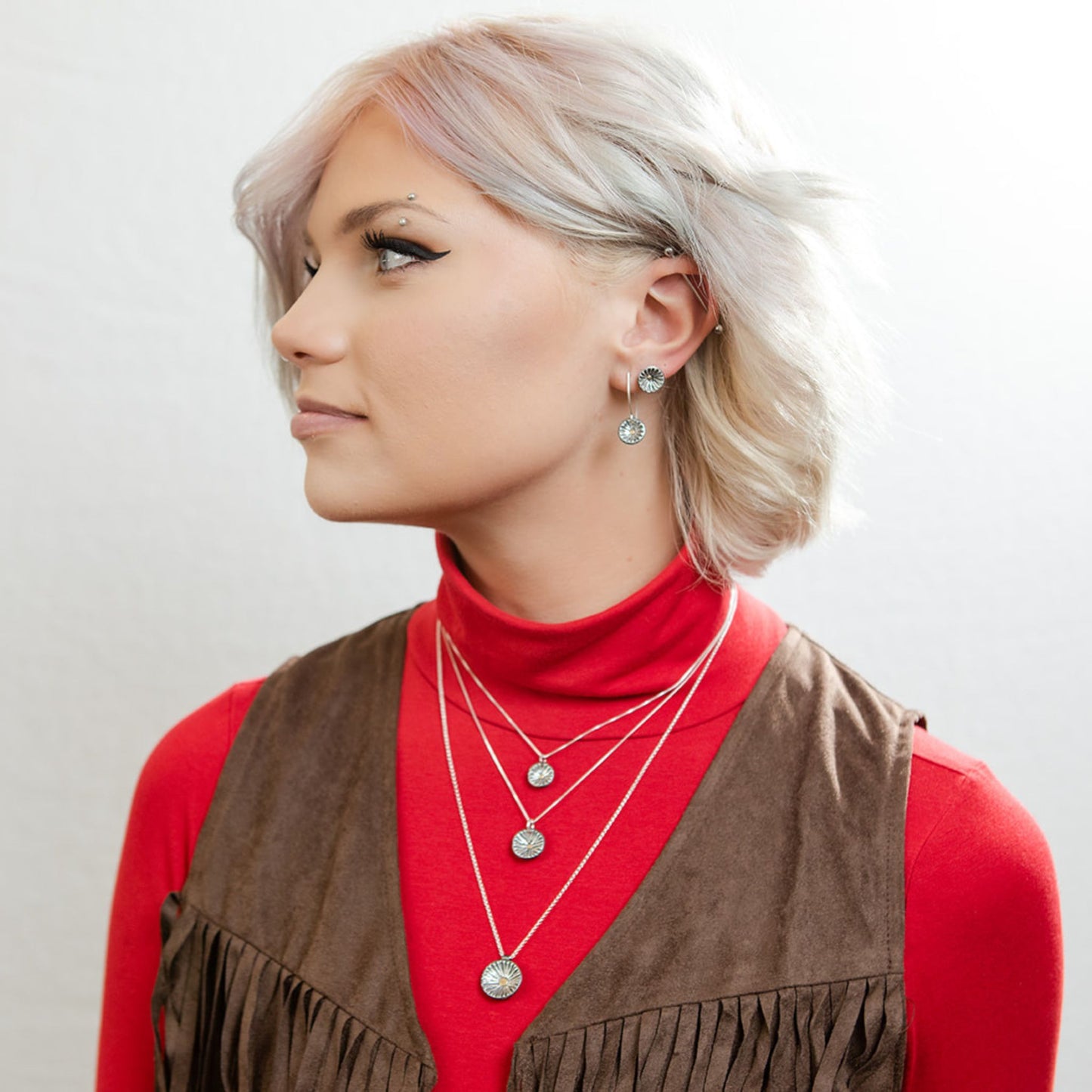 Model wearing radiance stud earrings