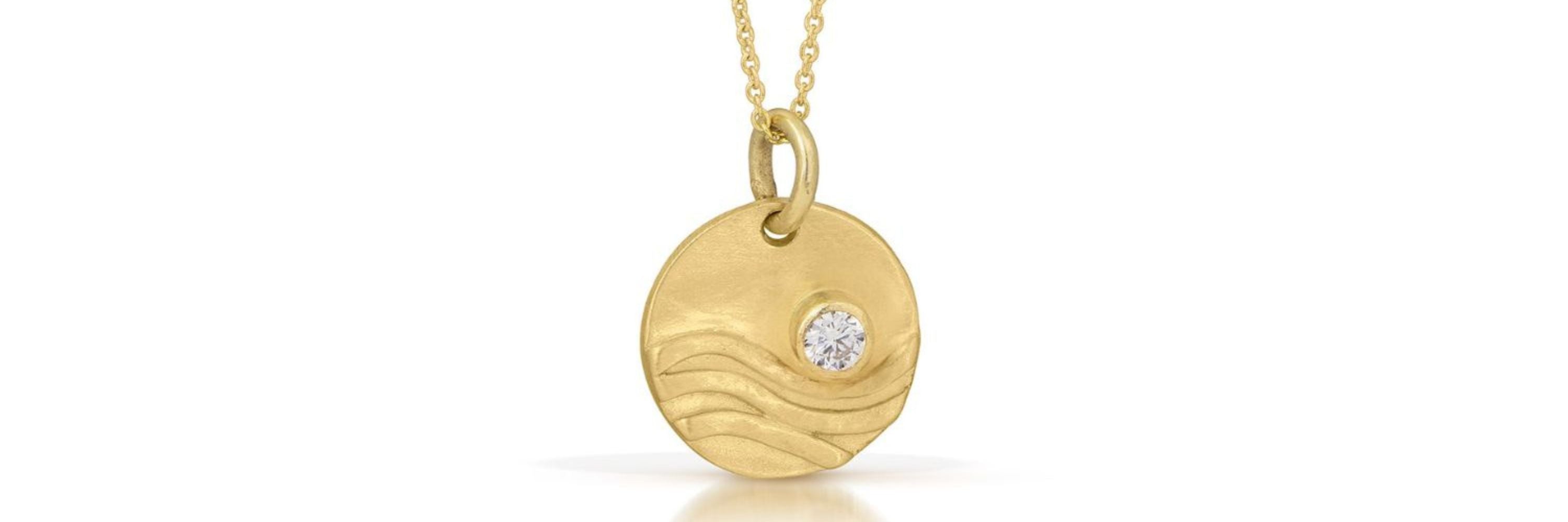 Jen Lesea 14K gold wave necklace with diamond sun