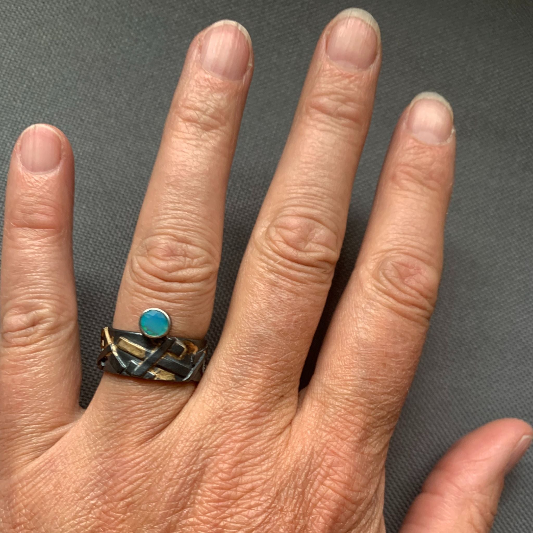 Blue opal ring on model