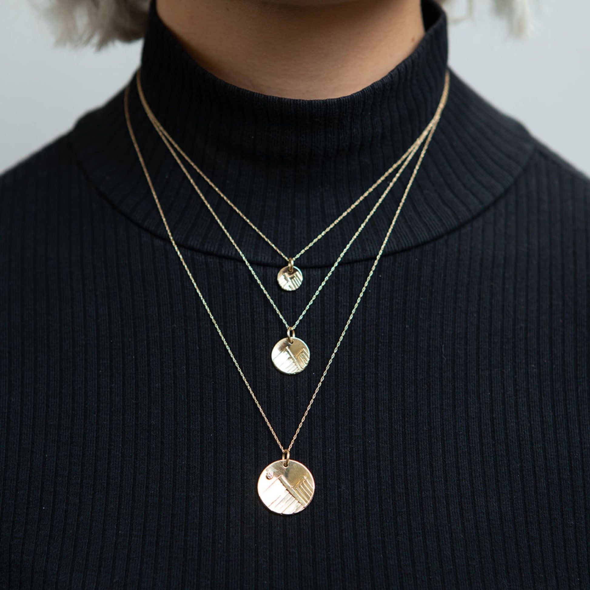 14K gold mountain necklaces on model