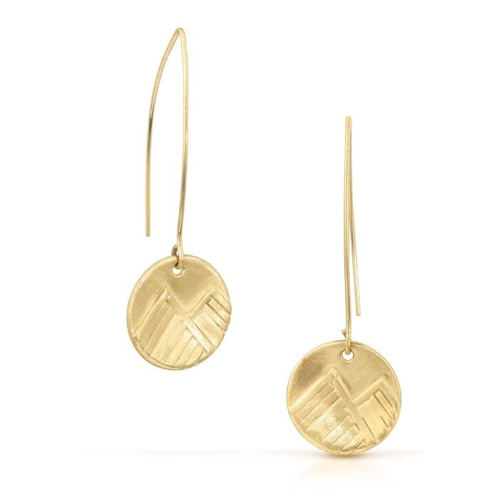 Gold earrings with geometric designs on a white background