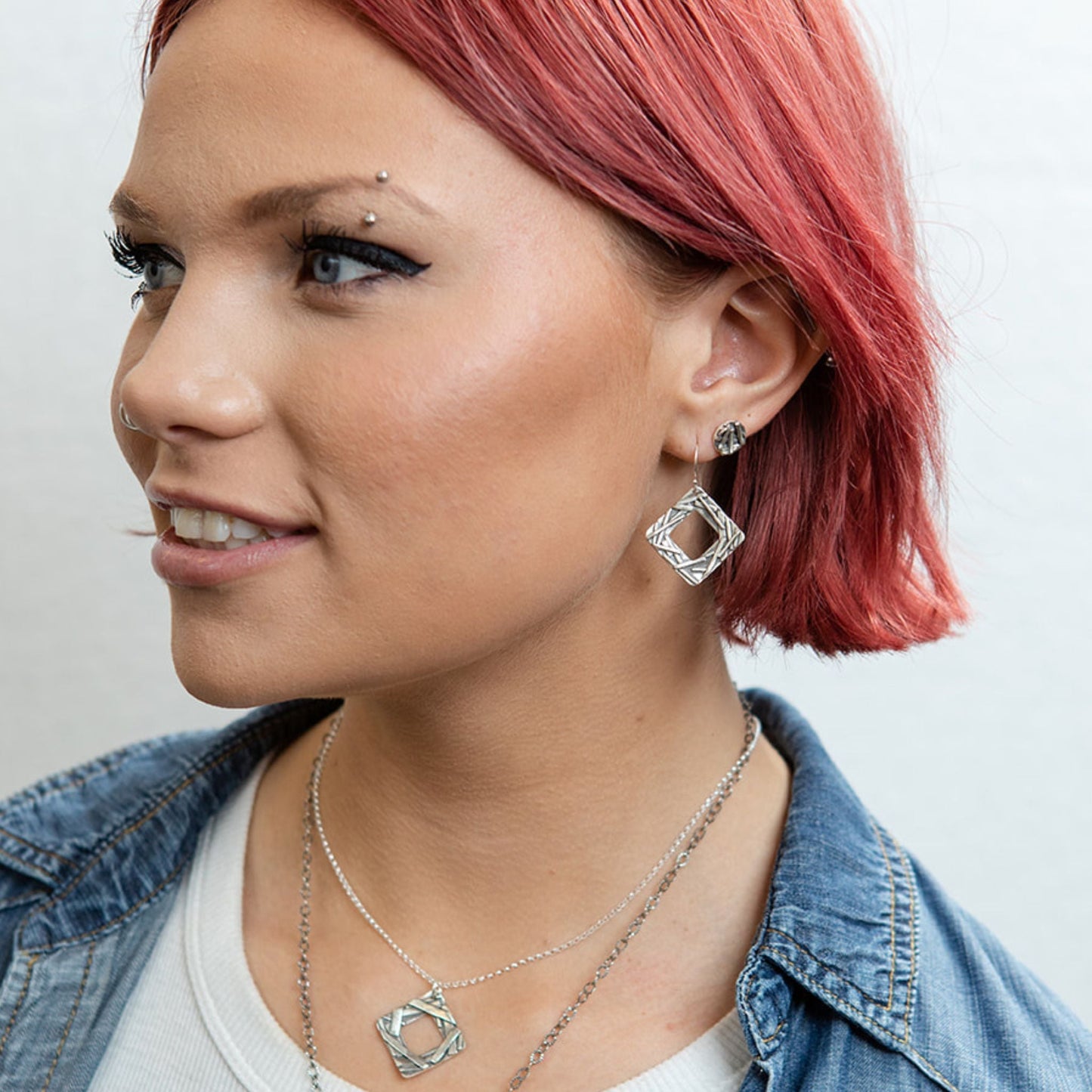 Square washer earrings on model