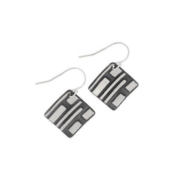 Pair of black and silver striped earrings on a white background