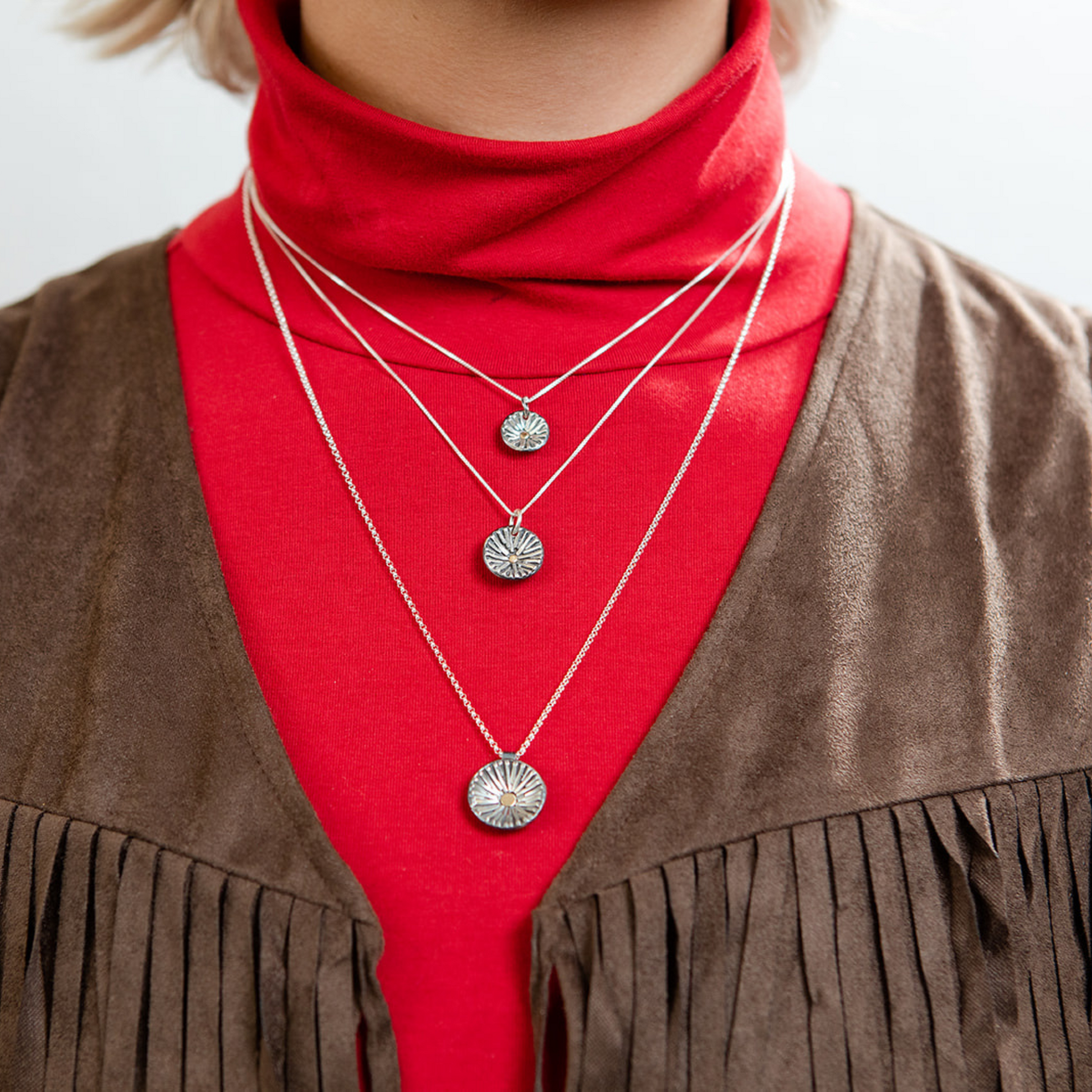 Closeup of model wearing radiance necklaces