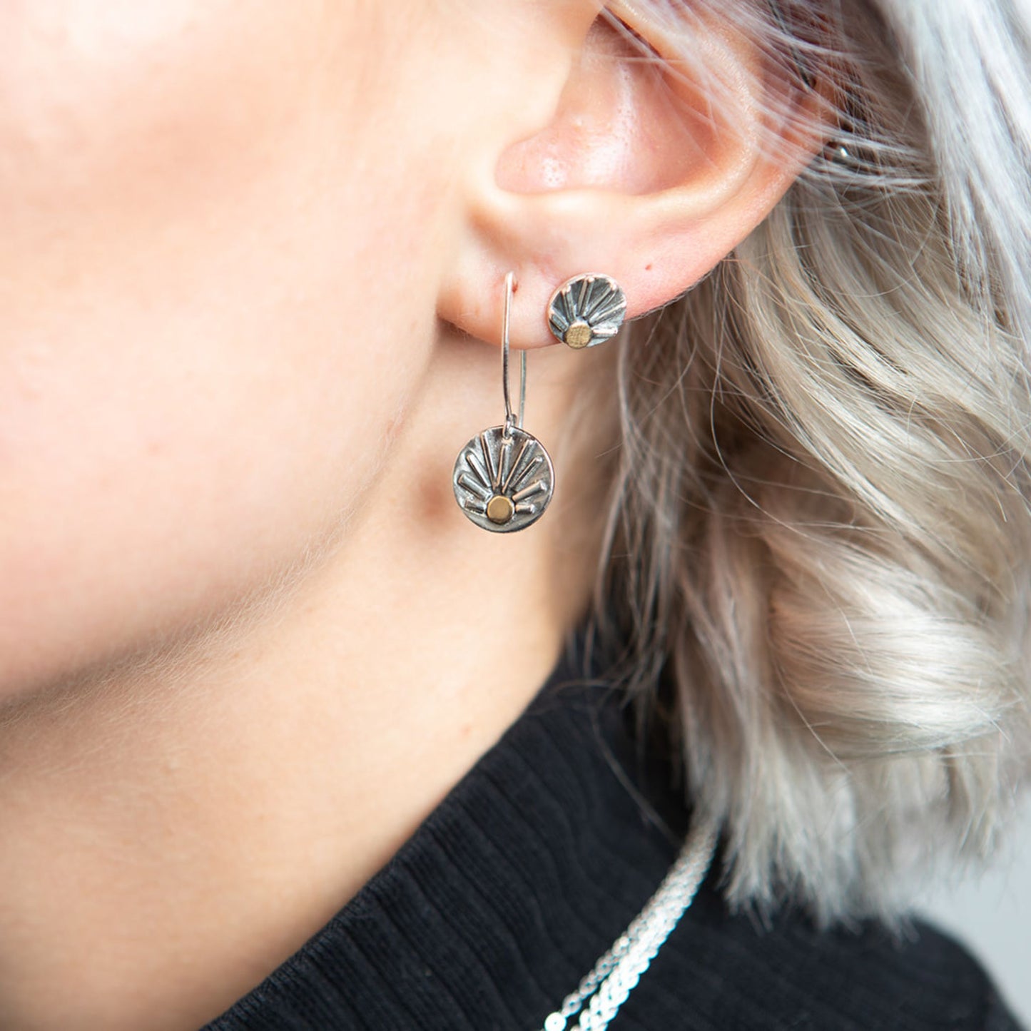 Closeup of model wearing shine earrings