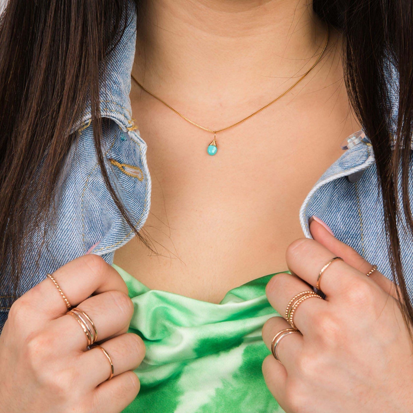December turquoise gold birthstone necklace on model