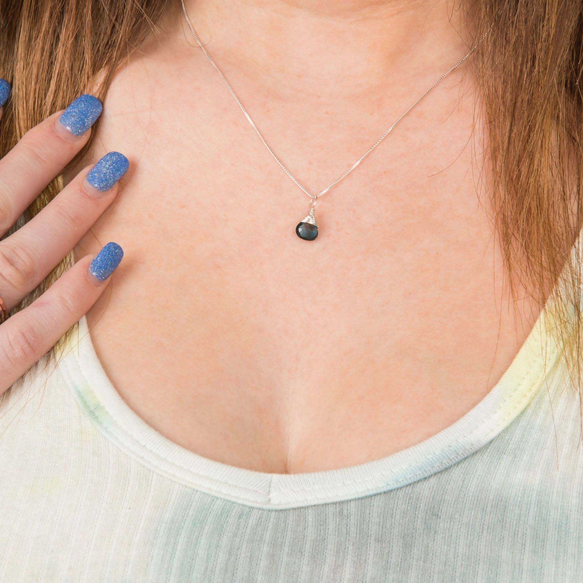 Model wearing December birthstone silver necklace