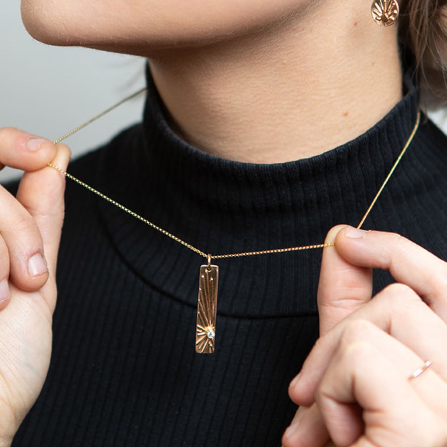 Model showing diamond gold shine bar necklace