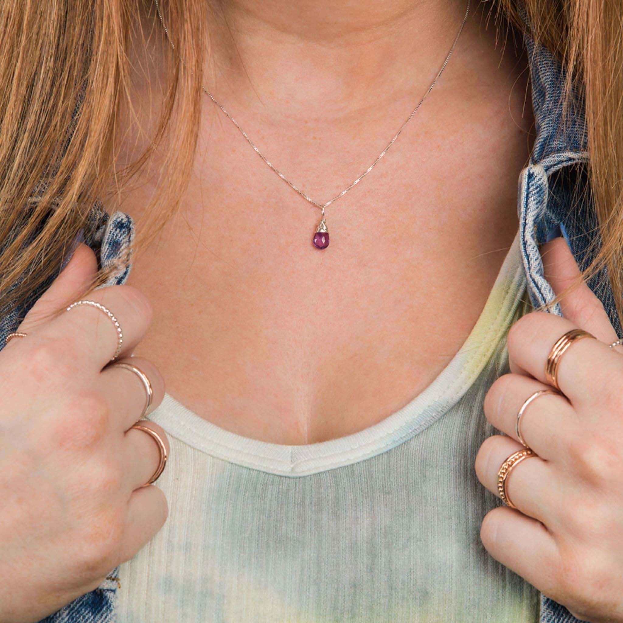 Model wearing February birthstone necklace, close up view