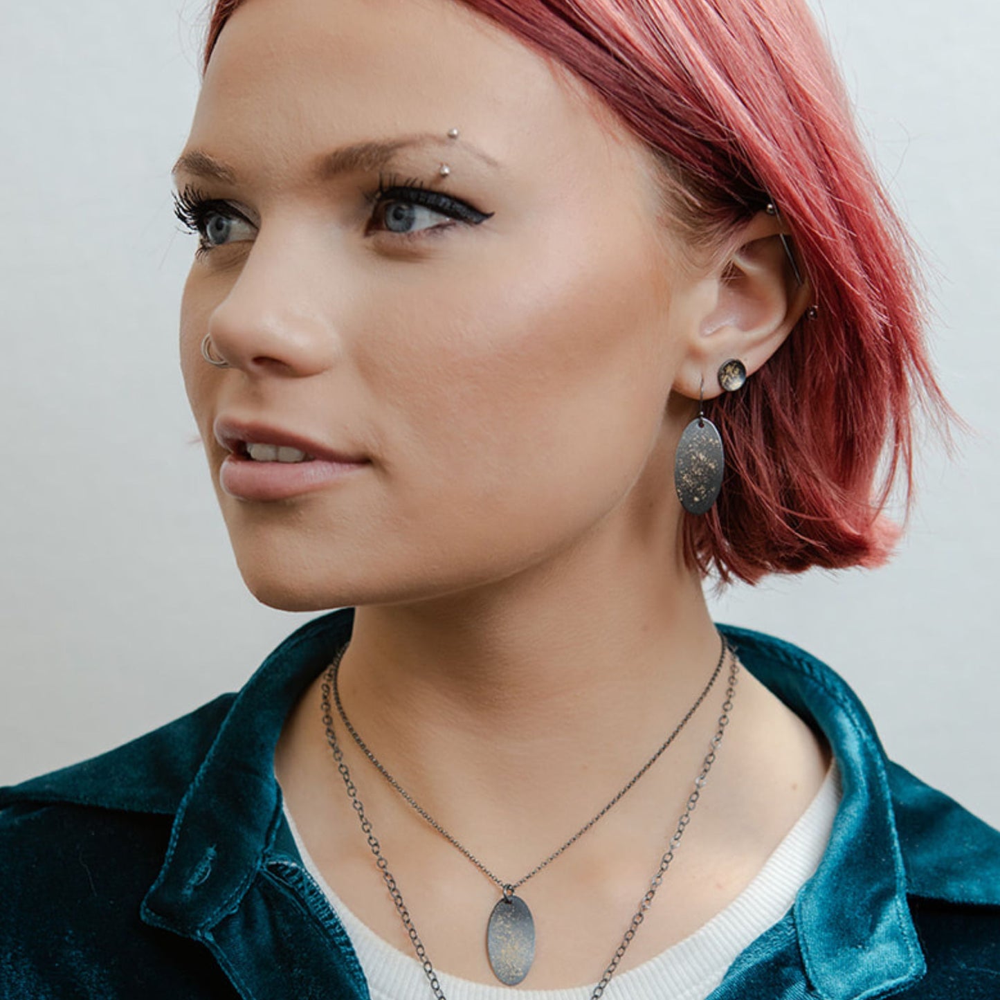 Galaxy oval earrings on model