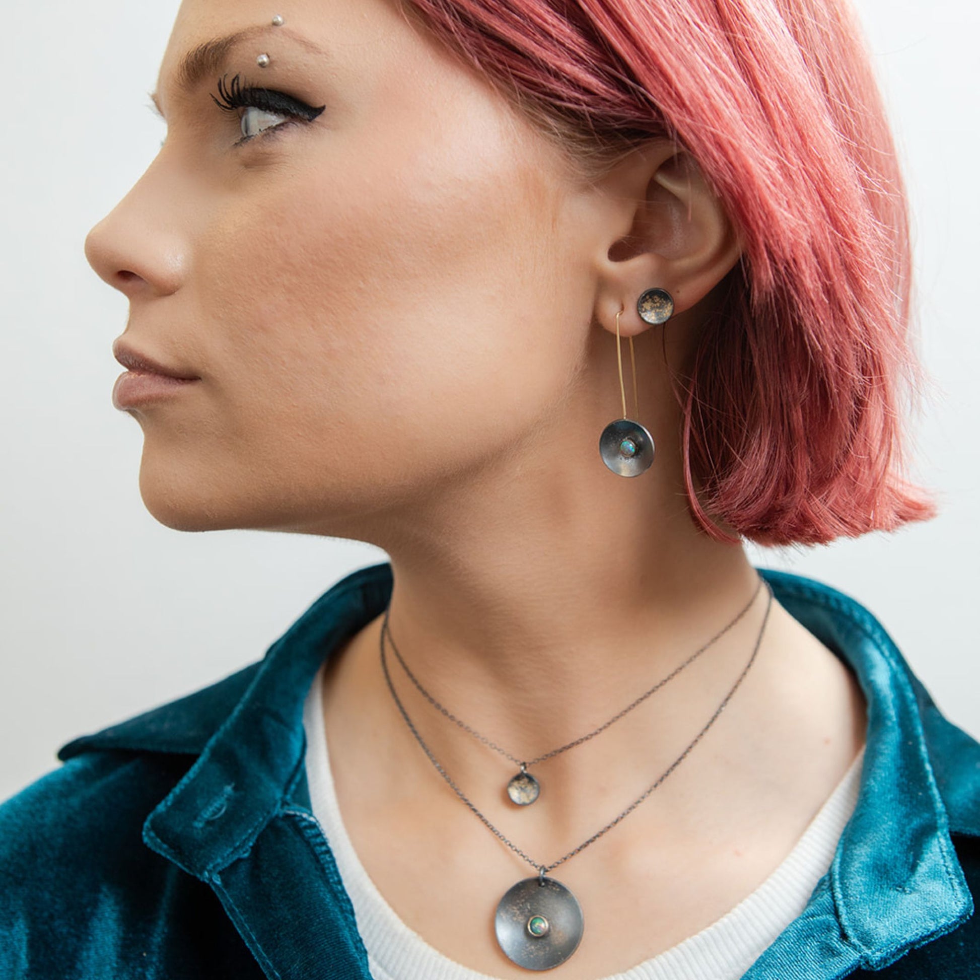 Galaxy black opal necklace on model