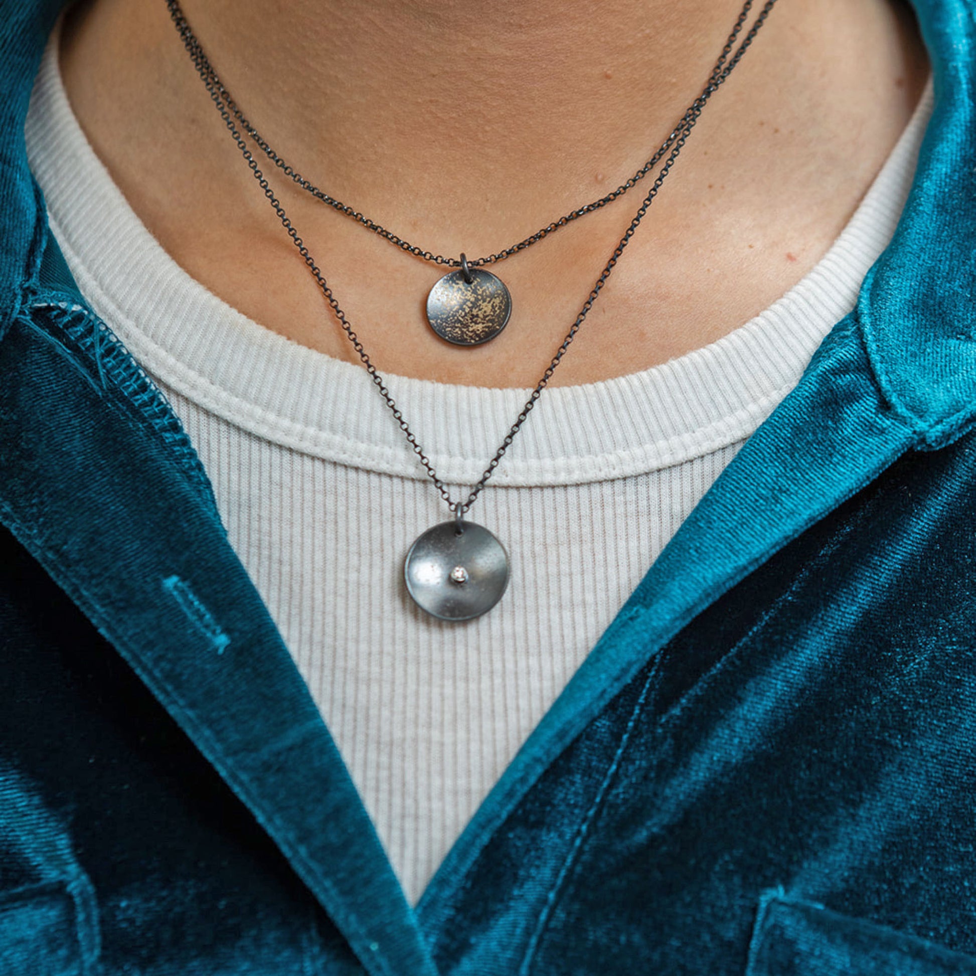 Galaxy diamond coin necklace closeup on model
