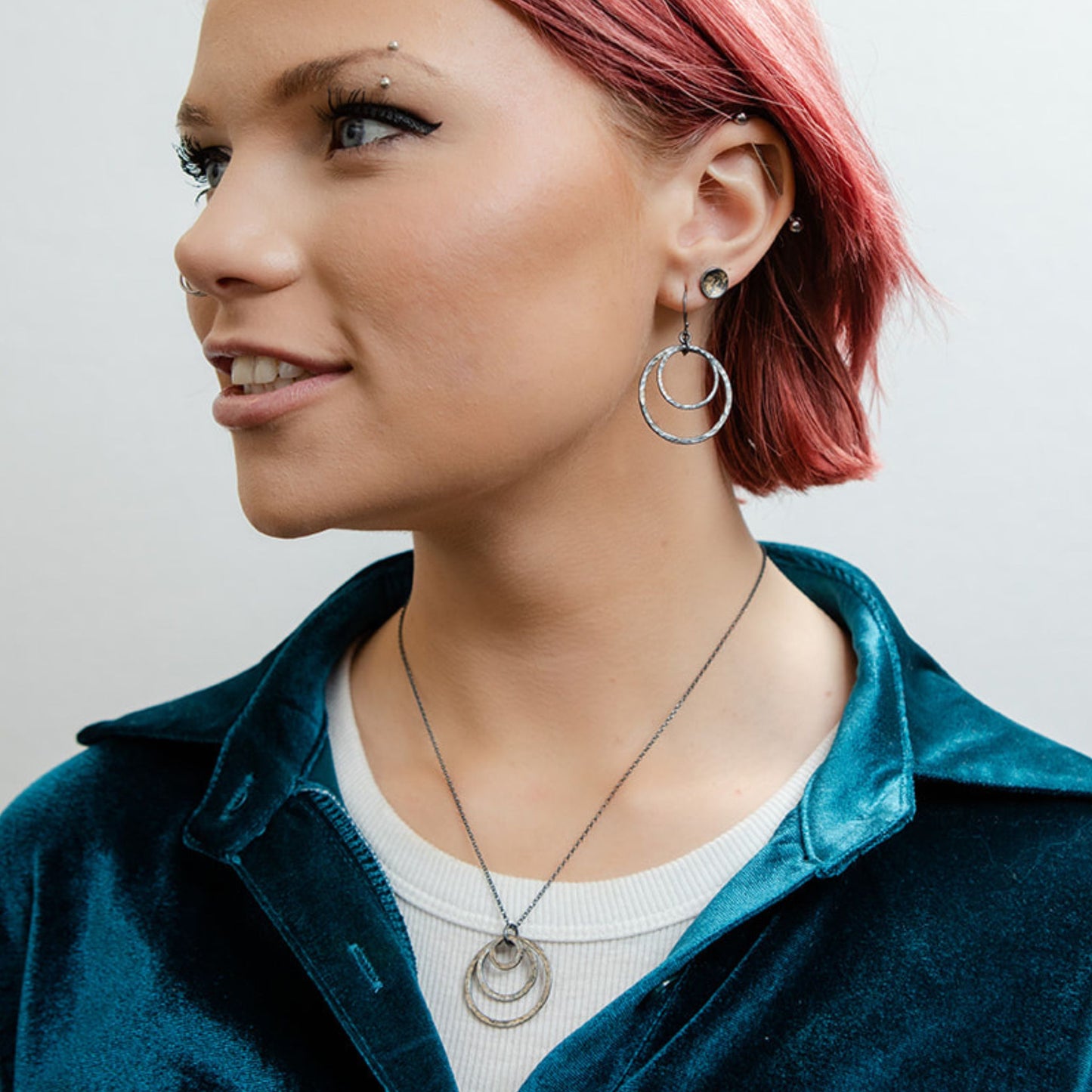 Galaxy hoop earrings on model