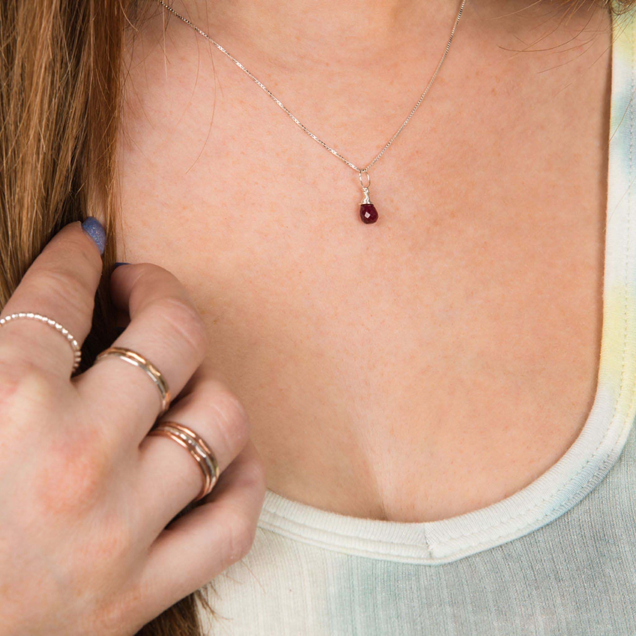 Model wearing July birthstone silver necklace