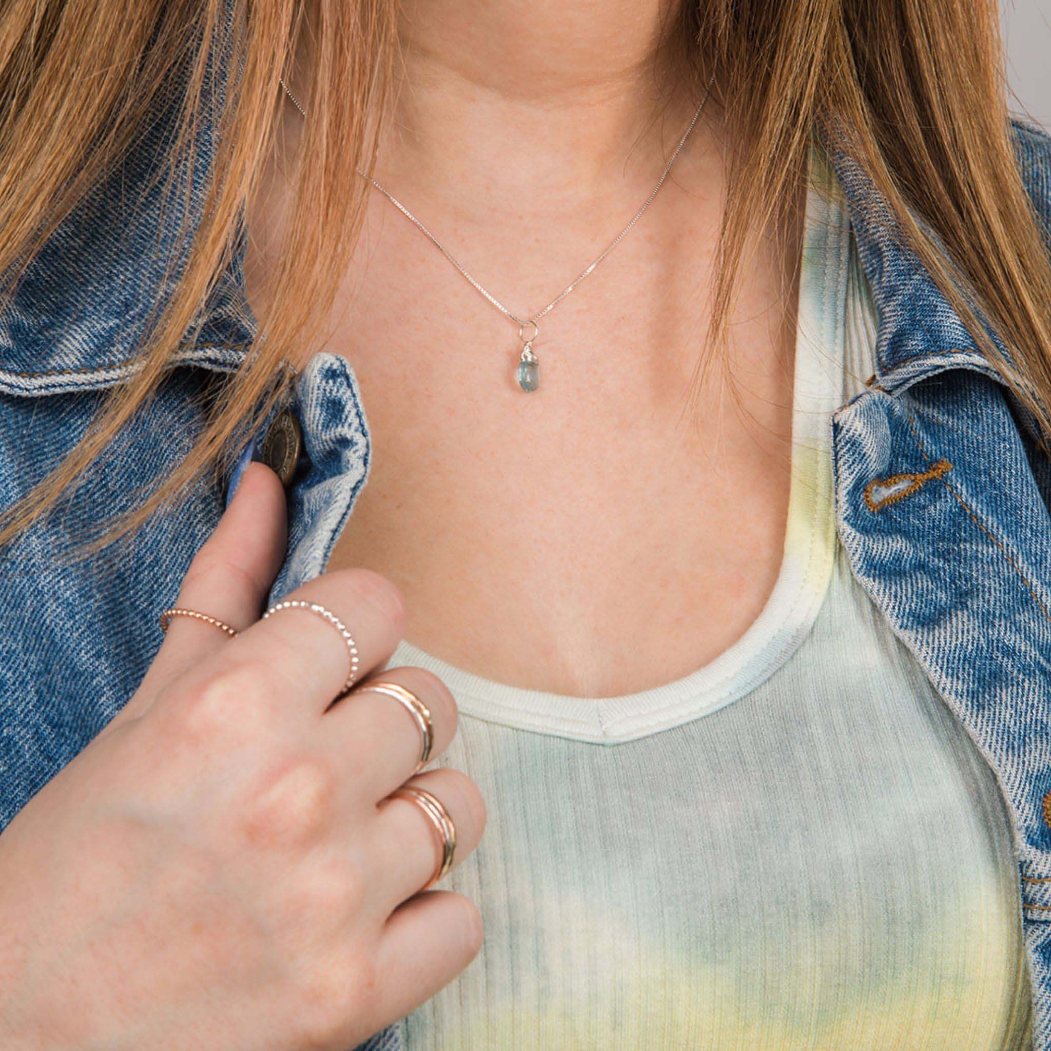 Model wearing March birthstone necklace