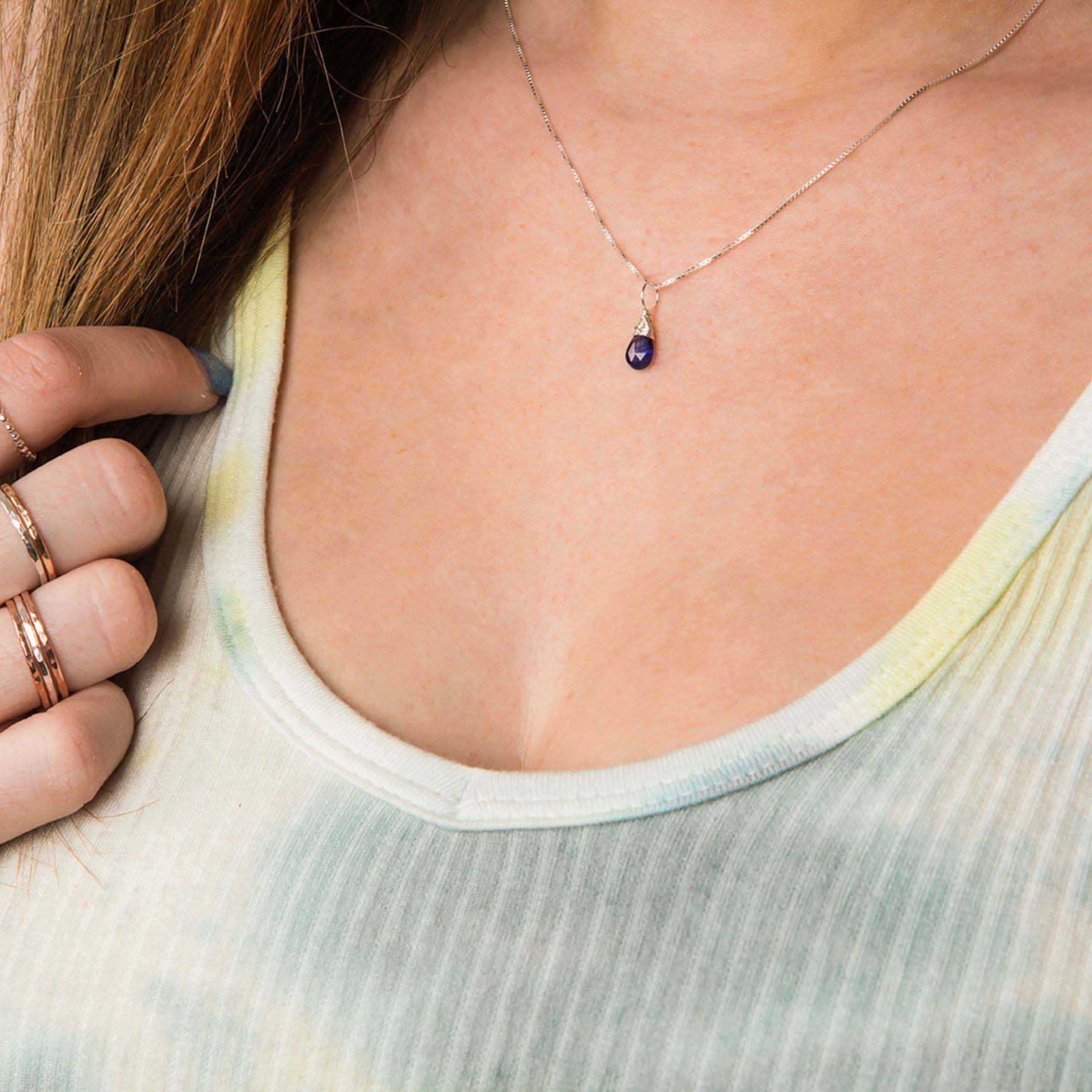 Model wearing September birthstone silver necklace